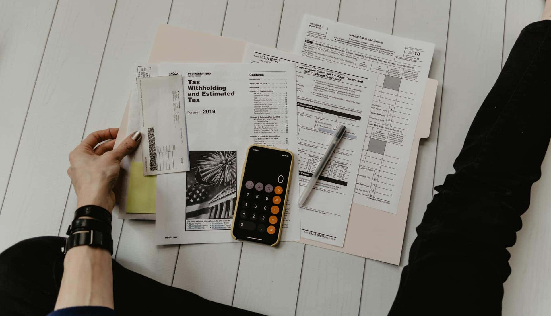Calculator and documents on a desk, budget planning